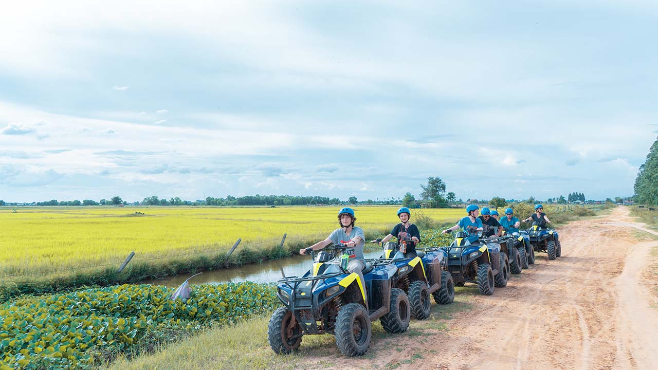 Quad bike riding in countryside fields